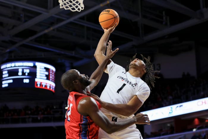 Nov 30, 2022; Cincinnati, Ohio, USA; N.J.I.T Highlanders forward Souleymane Diakite (left) fouls Cincinnati Bearcats forward Kalu Ezikpe (1) in the first half at Fifth Third Arena. Mandatory Credit: Aaron Doster-USA TODAY Sports